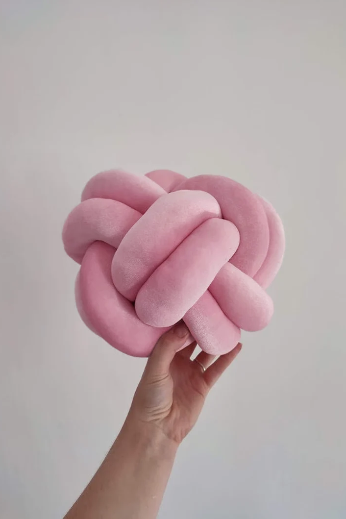 Pink top knot pillow
